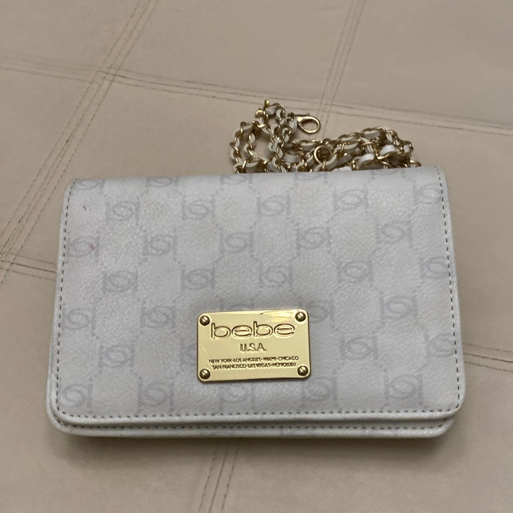 BEBE White clutch embelished with gold